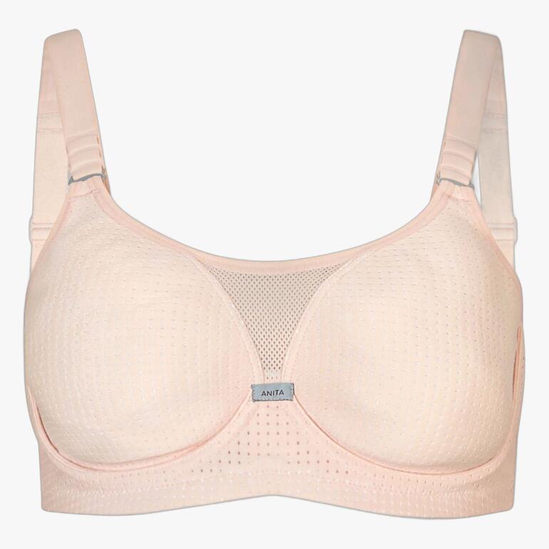 Soutien-gorge de sport beige avec une structure en filet aérée à l'avant.