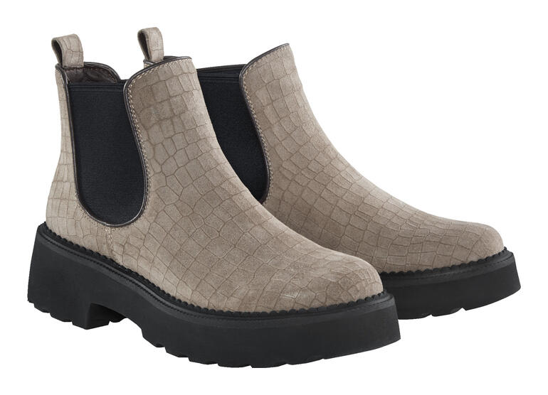 Deux bottes Chelsea beiges côte à côte, avec surface structurée.