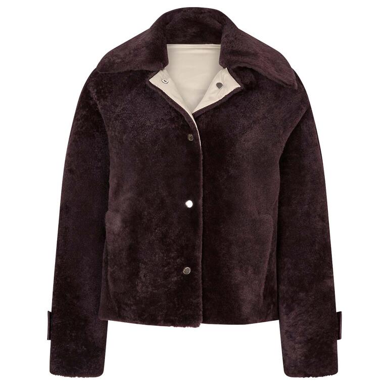Veste réversible en agneau de couleur brun foncé.