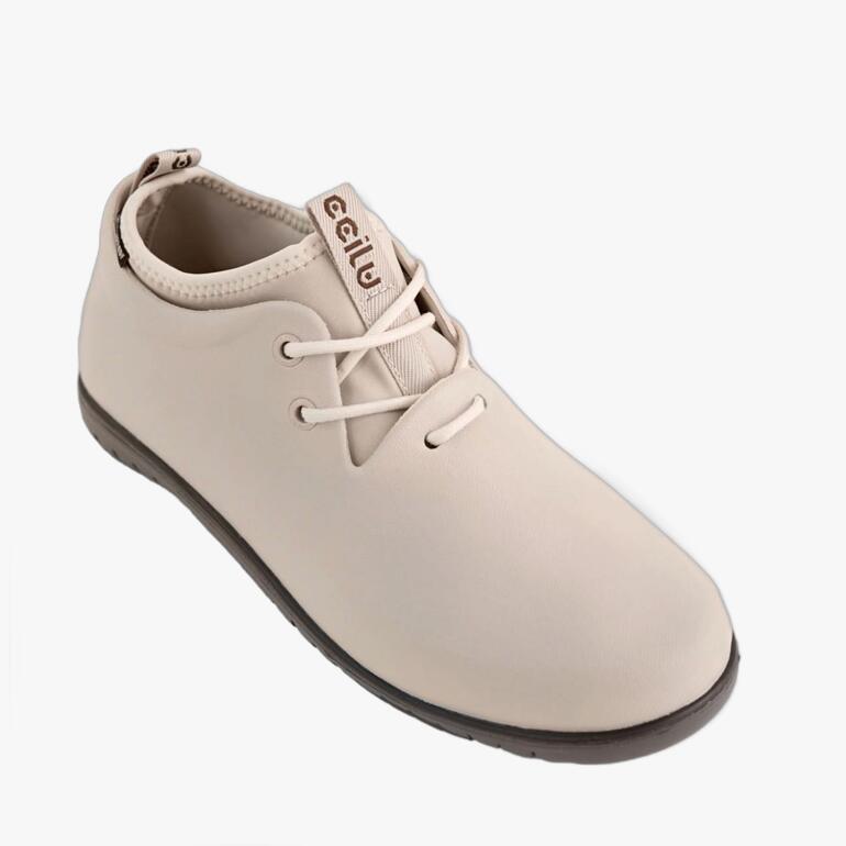 Bottes de pluie Ccilu beiges à lacets vues de côté.