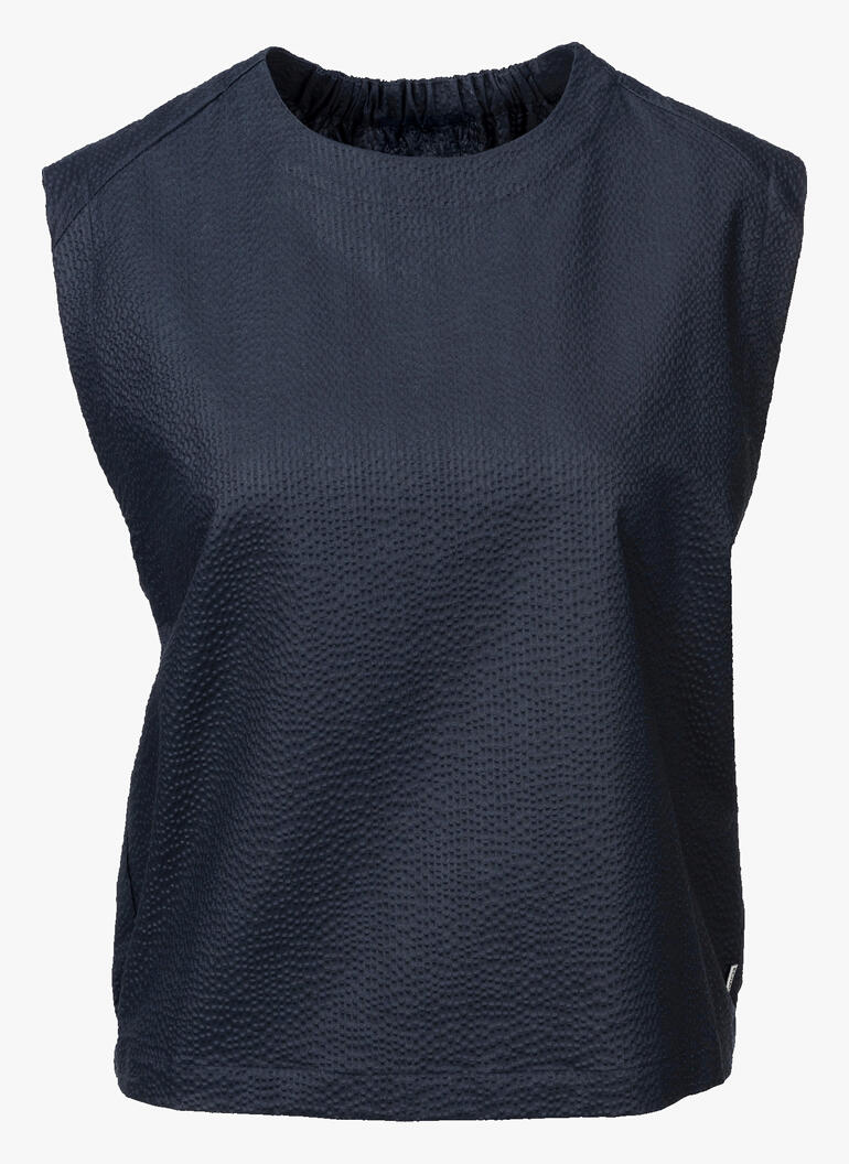 Chemisier bleu foncé à coupe droite.