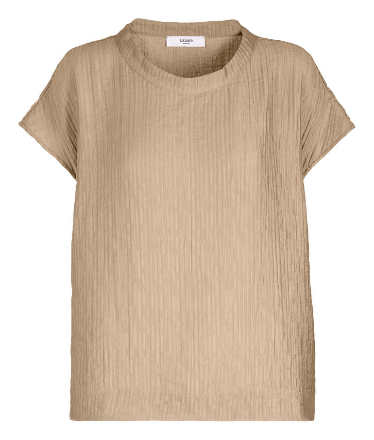 Blouse fluide en couleur sable, en tissu doux et à manches courtes, taille 34.