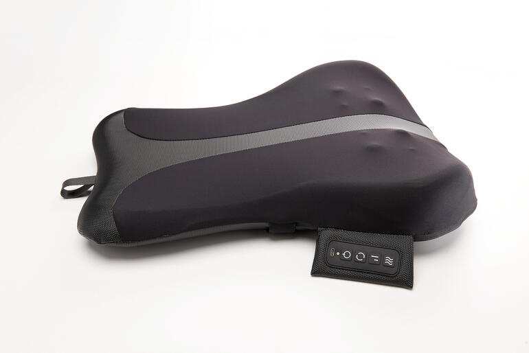 Appareil de massage du dos de couleur noire avec un design ergonomique.